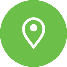 A white line art image of a map marker in a light green circle.